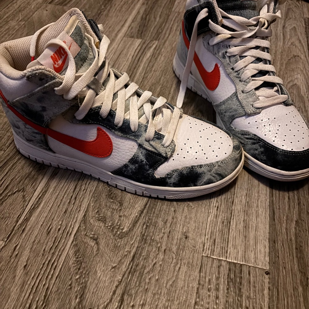 Nike High-Top Sneakers with Red Swoosh and denim material.